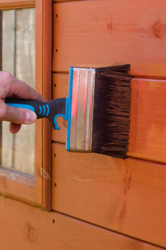Wood Siding Being Stained